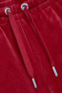 Displays the Red Dahlia 'Juicy' branded velour diamanté tracksuit bottom