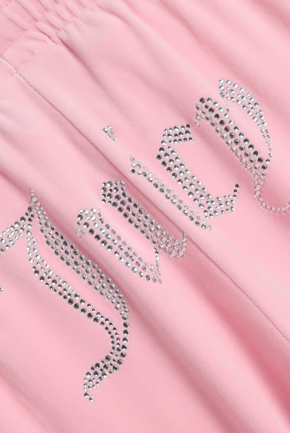 Displays the Juicy Pink 'Juicy' branded velour diamanté tracksuit bottom featuring the juicy branding 