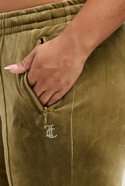 Displays the Dark Olive 'Juicy' branded velour diamanté tracksuit bottom