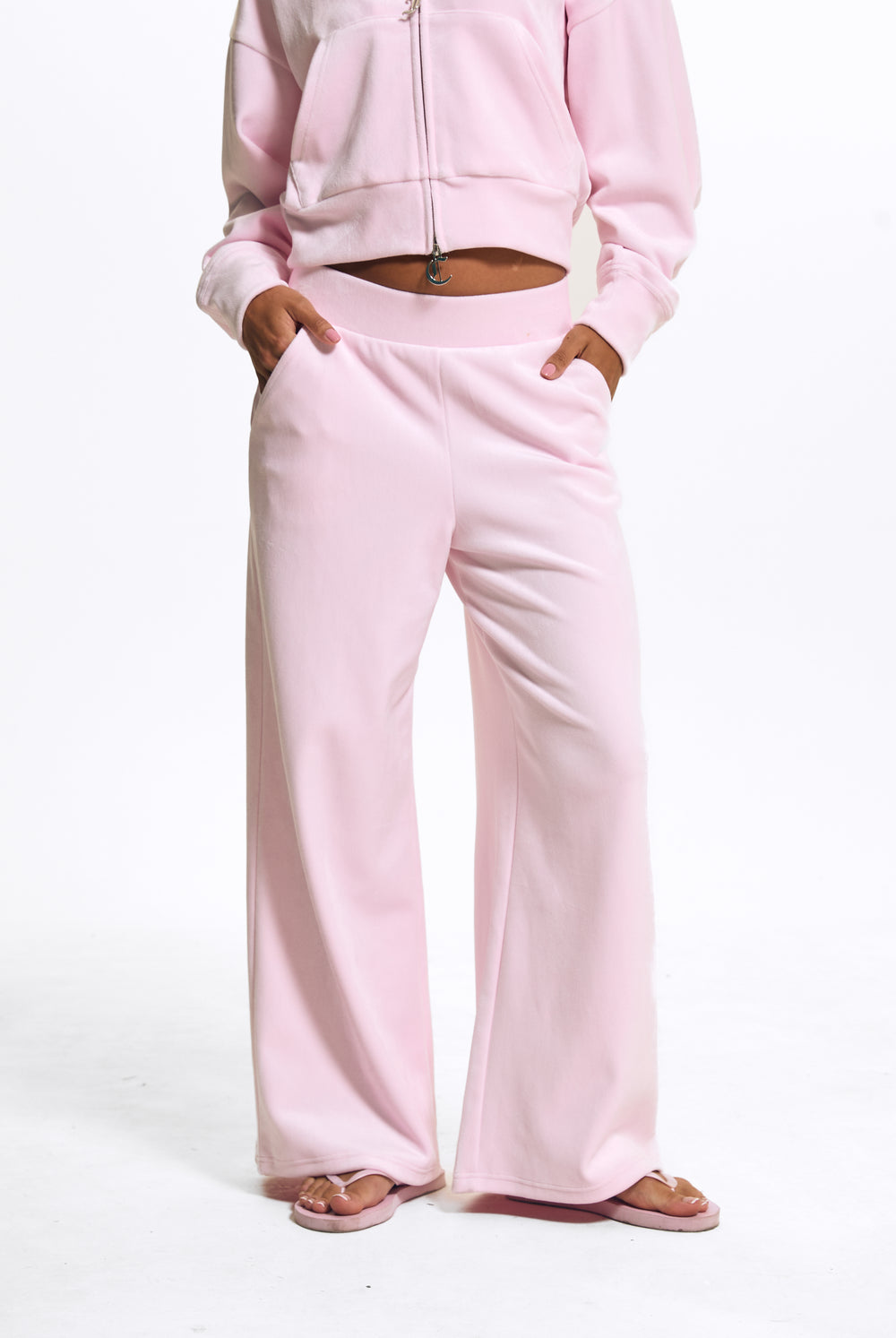 Displays a model wearing the Cherry Blossom 'Juicy' branded Velour Bonded Tracksuit Bottom