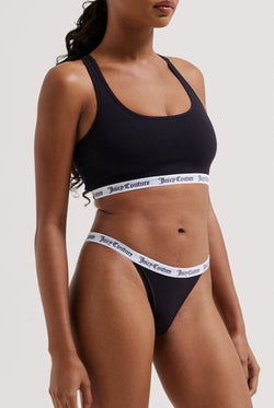 Displays a model wearing the Black 'juicy' branded cotton bralette