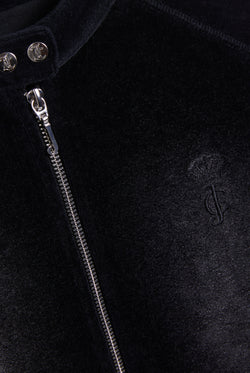 Displays the washed black 'juicy' branded cotton velour moto jacket featuring the juicy Couture logo and zip