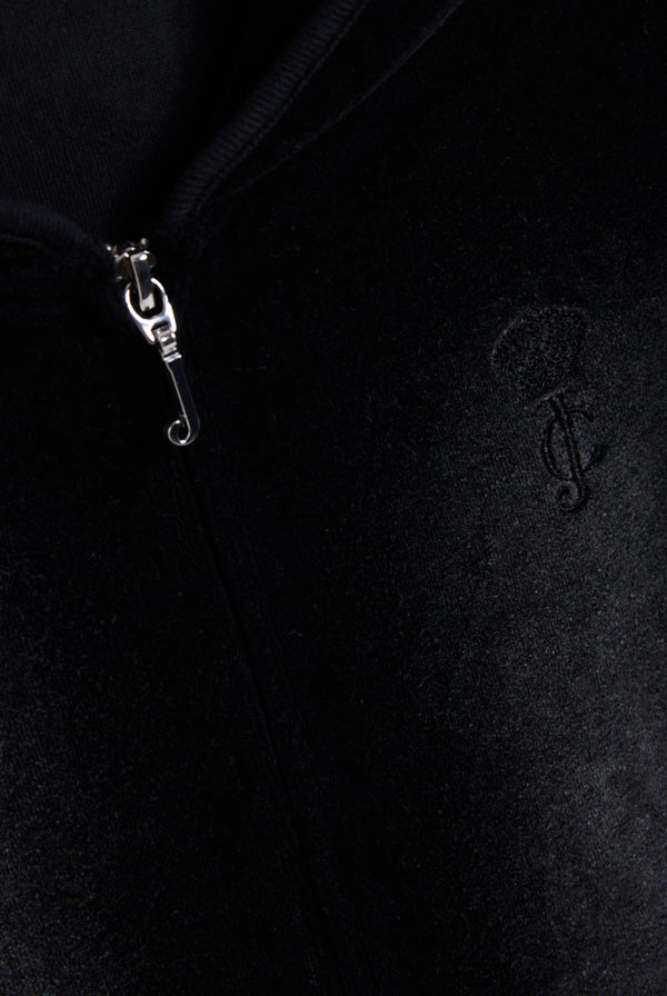 Displays the washed black cotton 'Juicy' branded velour heritage hoodie featuring the juicy logo and zip 