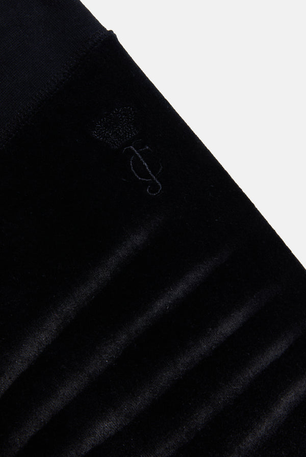 Displays he washed black cotton 'Juicy' branded velour og straight low rise pants 