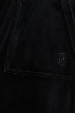 Display the Black 'Juicy' branded wide leg classic velour track pant featuring the juicy couture logo