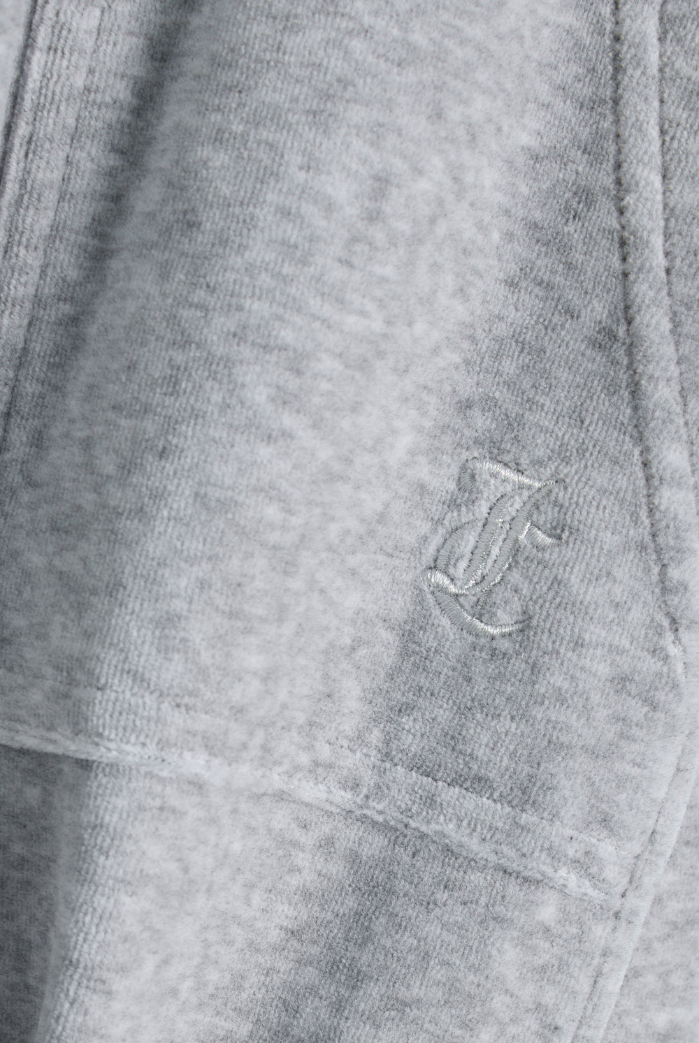 Displays the silver marl wide leg 'Juicy' branded cotton velour track pant featuring the juicy logo