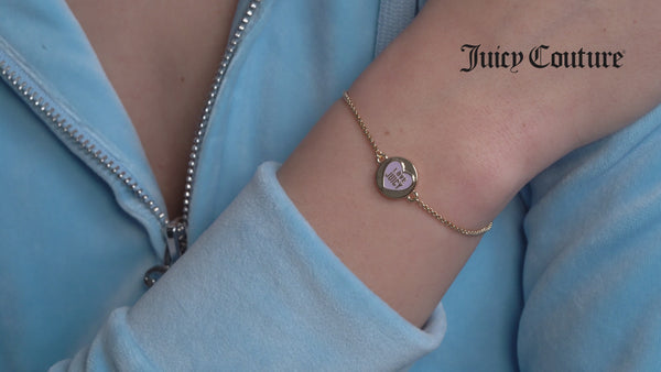 Displays a model wearing the 'Juicy' Gold Tone Love Juicy Reversible Enamel Adjustable Bracelet